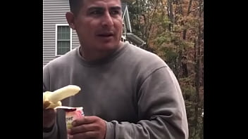 Straight construction man sucks banana