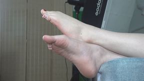 Mei Mei relaxes on the sofa while playing with her phone