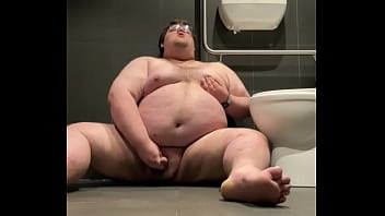 Chubby plays in public bathroom