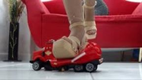 crushing the super red Montoy Toy Truck with wooden Sam Edelman sandals and Nylons