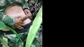 Young military twink jerks off in the woods