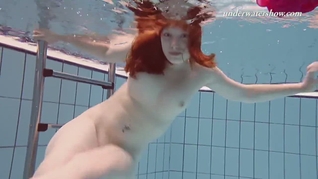 Underwater swimming teenie Lenka gets naked
