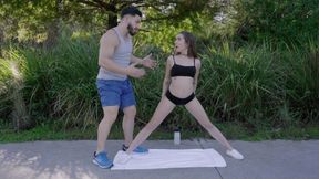 Bailey Base gets help stretching out into the splits
