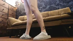 Large house slippers and socks play in room