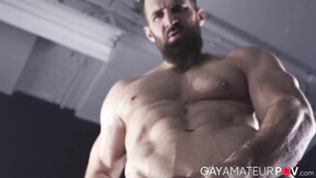 ”Bushy hunk Chuck Conrad works his thick cock with his two hands after flexing”