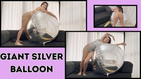 Playing with my giant silver balloon