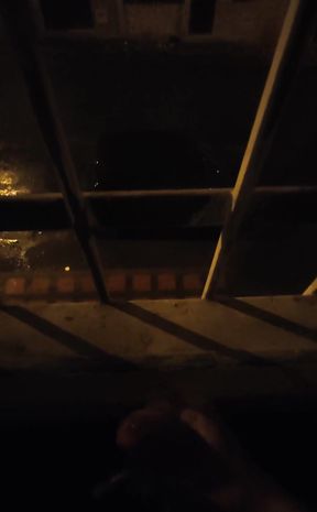 Playing on the window with cars passing by