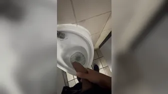 Twink cruising in London public restroom gets handjob from strangers