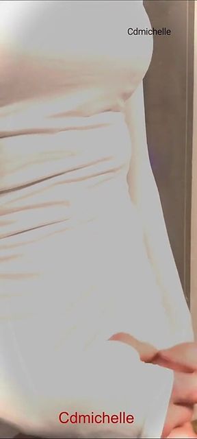 Cdmichelle Wearing Black Bodysuit Putting on White Dress