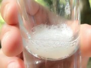 Spitting guy´s thick cum to the glass and drinking it again after blowjob outdoor