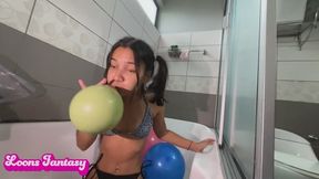 Akina blows up balloon on the showe