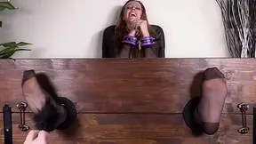 Gorgeous Elettra's nylon-clad feet locked in the pillory for a mind-blowing tickling session