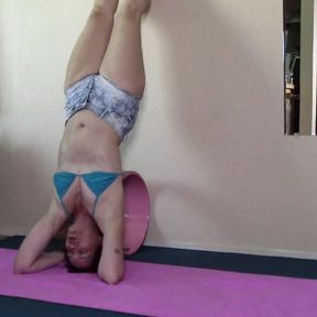 Evening yoga in shorts and bikini top