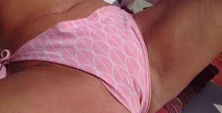 Caressing my tits and rubbing off over my bikini laid outside in the sunshine