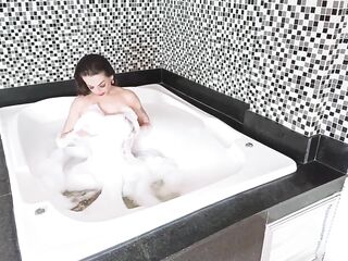 Trans gal takes a bubble baths ans masturbates
