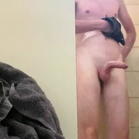 In the public showers of a campground with an erection and a little pee