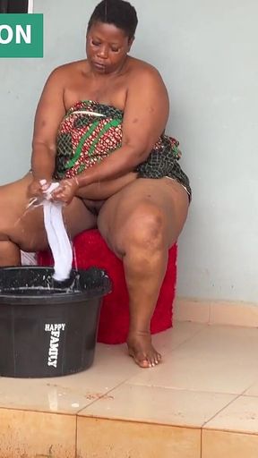 African Mama Multitasks on a Sunday Morning