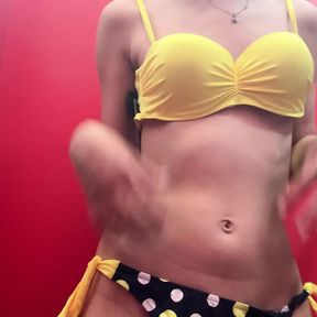 Step sister tries on swimsuits in the fitting room