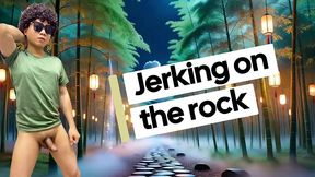 lying in rock naked and jerking off