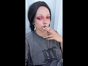 Smoky eyes half-lidded as she exhales slow smoke 😳