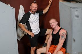 Muscular DILF fucks with young hunk at the locker room