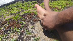 massaging my feet on the beach