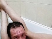 Legs behind the head in a bathtub while touching my cock and showing off feet soles