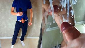 A guy in sweatpants cummed all over the mirror with fresh cum