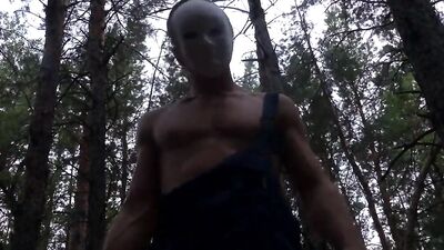 Monster in a mask fucks a stuck soldier in the forest