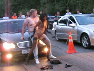 The crazy stripper girl in Russia on the car race show