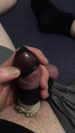 Tied cock and balls with condom socks fuck