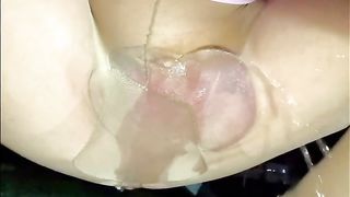 Sissy pissing in her stockings outside