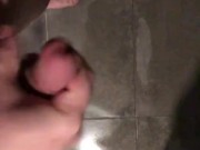 Stocky guy wanking his thick cut cock in the shower with big cumsot