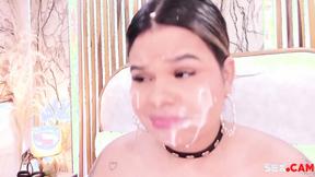 ”chubby babe with fake cum on her face sucks a big dildo”