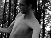 Slender man running around the forest completely naked black and white video