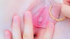 sanding her pussy with gold between her lips