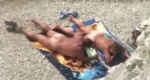 Kinky mature sunbathing wife gets her pussy fingered a bit on the beach