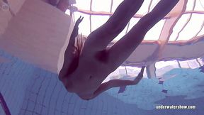 Slim Russian girl Lucy Gurchenko swims naked in underwater show
