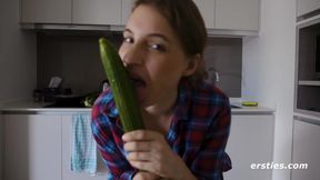 Gorgeous Julia has fun with long green cucumber