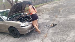 Woman repairs antique car using her feet to pump pedals (3)