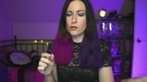 Genny Rock is smoking while doing her hair