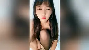 Asian MILF gets fucked by a white skunk on camera.