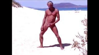 Tanned guy on beach in tiny string thong (temporarily!)