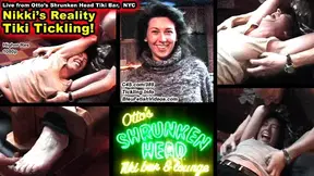 Nikki's Reality Tiki Tickle! at Otto's Shrunken Head in NYC, Nikki is tickled in the bar and put into foot stocks
