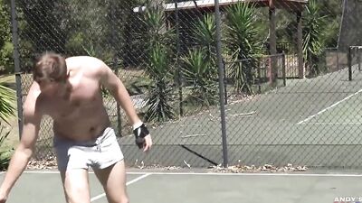 Naked handsome guys are playing some sports outdoors on a sunny day