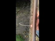 Twink piss from the bridge into the river