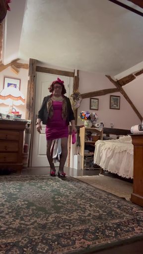 Dressed in a short fuchsia dress for an evening out