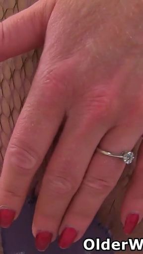 UK MILF Holly Kiss Exposes Her Swollen Labia in Fishnets