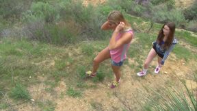 Two lesbo babes have fun in mountains