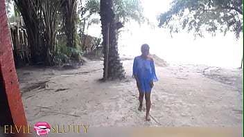 Shy ebony girl playing half naked in the beach